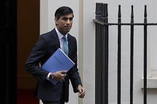 Britain's Chancellor Rishi Sunak leaves Downing Street to attend Parliament in London, Wednesday, Nov. 25, 2020.