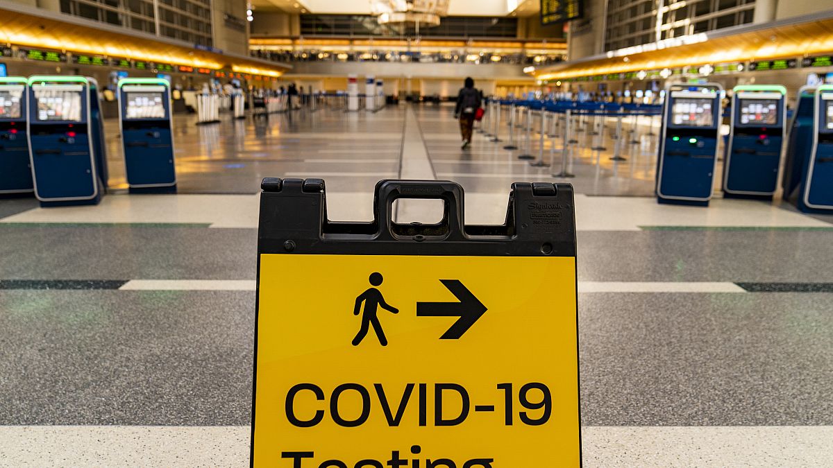 A COVID-19 testing sign is posted at the empty Tom Bradley International Terminal at Los Angeles International Airport Wednesday, Nov. 25, 2020.