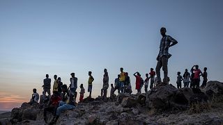 Tigray people who fled the conflict in Ethiopia's Tigray region stand on a hill above Umm Rakouba refugee. Eastern Sudan. Nov 26, 2020. 