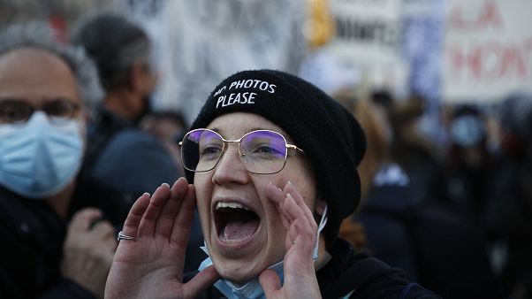 A protester shouts during a demonstration security law that would restrict sharing images of police, Saturday, Nov. 28, 2020 in Paris. A protester shouts during a demonstration security law that would restrict sharing images of police, Saturday, Nov. 28, 2020 in Paris.
