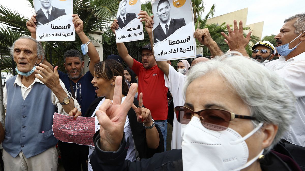 People gather in a show of support to Khaled Drareni,outside the court house Tuesday, Sept.8, 2020 in Algiers.
