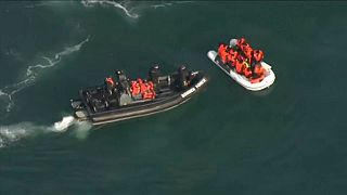 Dinghy with suspected migrants being intercepted by a UK Border Force boat, Aug 2020