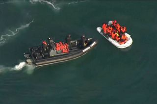 Dinghy with suspected migrants being intercepted by a UK Border Force boat, Aug 2020