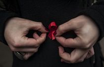 Red ribbons are the symbol of the fight against AIDS