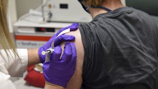 This May 4, 2020, file photo provided by the University of Maryland School of Medicine, shows the first patient enrolled in Pfizer's COVID-19 coronavirus vaccine trial.