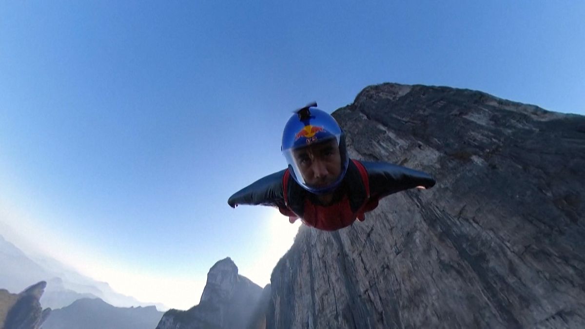 Wingsuit athlete flying to Tianmen Mountain