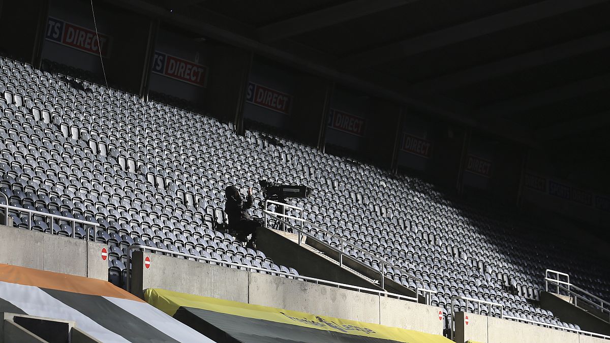 Empy stands at Newcastle United's St. James' Park stadium.
