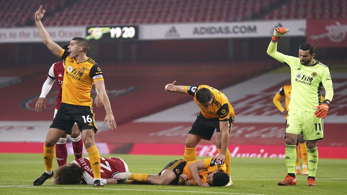 Wolverhampton forward Raul Jimenez was hospitalized with a serious head injury after colliding with Arsenal defender David Luiz on Sunday