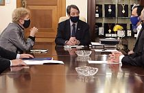 Cyprus President Nicos Anastasiades, center, United Nations Secretary General advisor Jane Holl Lute, left, and Cyprus' foreign minister Nicos Christodoulides, right, meet.