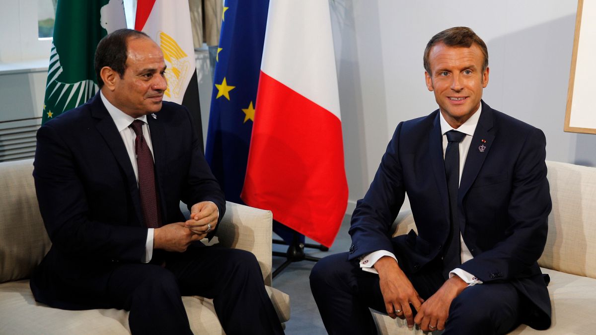 Egyptian President and Chairman of the African Union Abdel Fattah al-Sissi (L) and French President Emmanuel Macron pose prior to their a bilateral meeting in Biarritz, south-
