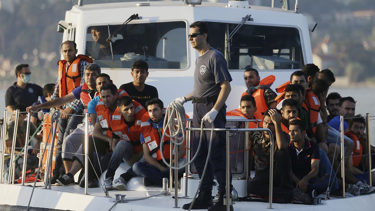 Greek Coast Guard vessel arrives carrying migrants at the port of Mytilene