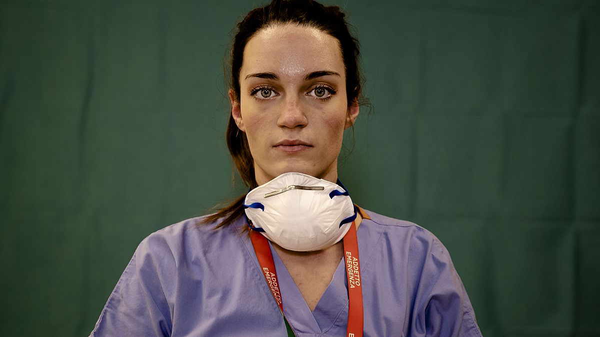 Martina Papponetti, 25, a nurse at the Humanitas Gavazzeni Hospital in Bergamo, Italy, poses for a portrait at the end of her shift on the front lines of the pandemic