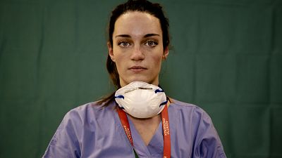 Martina Papponetti, 25, a nurse at the Humanitas Gavazzeni Hospital in Bergamo, Italy, poses for a portrait at the end of her shift on the front lines of the pandemic