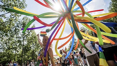 participants walk towards the Parliament building during the Pride March at the Budapest Pride LGBTQ Festival in Budapest, Hungary. participants walk towards the Parliament building during the Pride March at the Budapest Pride LGBTQ Festival in Budapest, Hungary.