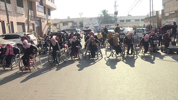Palestinians with disabilities taking part in a marathon. Palestinians with disabilities taking part in a marathon.