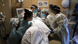 In this Nov. 19, 2020, file photo, medical personnel prone a COVID-19 patient at Providence Holy Cross Medical Center in the Mission Hills section of Los Angeles.