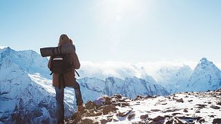 Hiker in Mountains in Winter