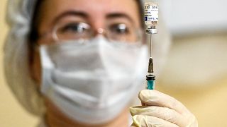 A health workers readies the COVID-19 vaccine in Moscow