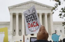 File photo: People rally outside the Supreme Court, Washington, as arguments are heard in the case of President Trump's decision to end DACA. Nov. 12, 2019.