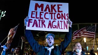 Jake Contos, a supporter of President Donald Trump, chants during a protest against the election results outside the central counting board at the TCF Center in Detroit.