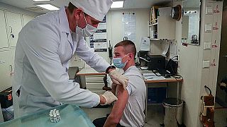 In this photo distributed by the Russian Ministry of Defence Press Service on 3 December 2020, a Russian Navy sailor receives a vaccine injection.