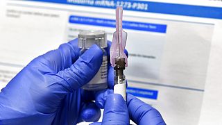 , a nurse prepares a syringe during a study of a possible COVID-19 vaccine, developed by the National Institutes of Health and Moderna Inc