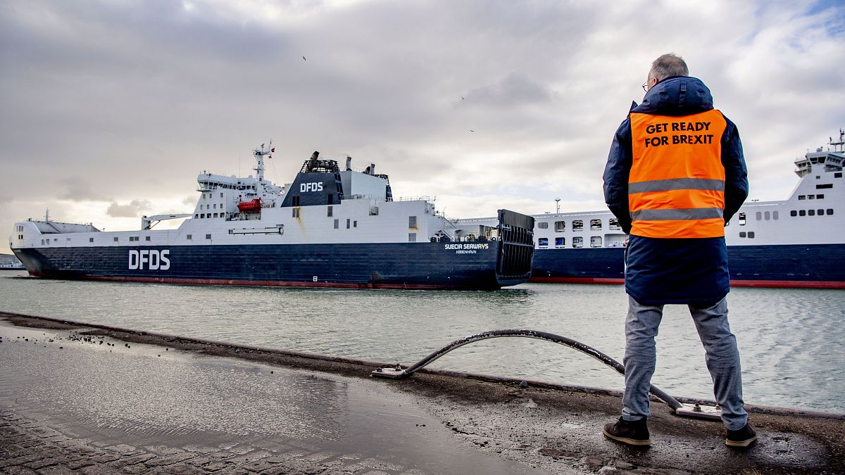 A man stand at the DFDS buffer zone before a press conference, as part of the Get Ready For Brexit campaign, at the DFDS ferry terminal at Rotterdam port, December 1, 2020.