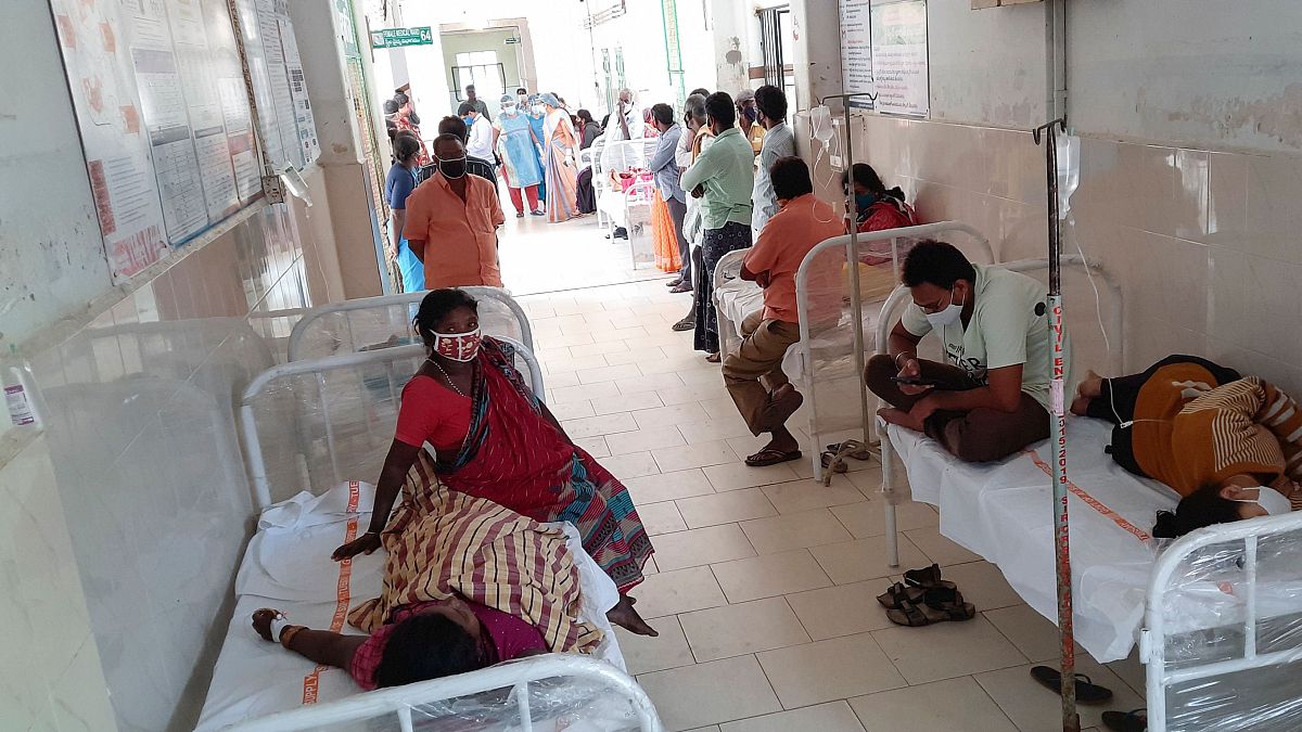 Patients and their bystanders are seen at the district government hospital in Eluru