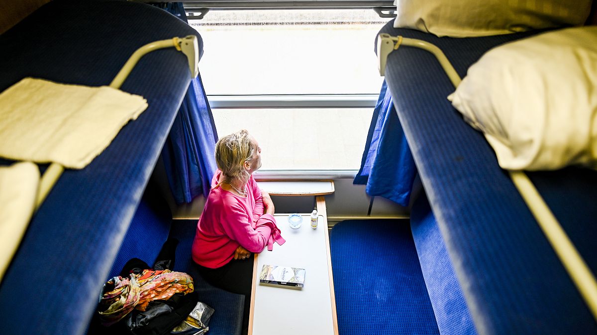 A woman is waiting in a compartment of a night express train in Westerland, Germany. on July 4, 2020.