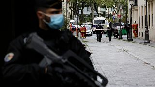 A French gendarme guards a street after a knife attack near the former offices of satirical newspaper Charlie Hebdo, Friday Sept. 25, 2020 in Paris. 