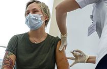 A Russian healthworker is among the first to receive the Sputnik V vaccine against COVID-19 on December 5, 2020.