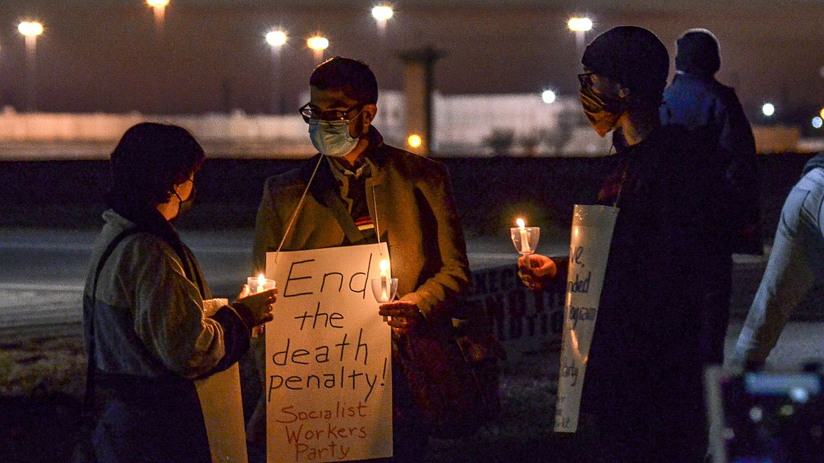 A protest against the execution of Brandon Bernard across Prairieton Road from the Federal Death Chamber in Terre Haute, Ind., on Thursday evening, Dec. 10, 2020. 