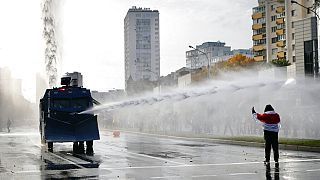 Police use a water cannon against demonstrators during a rally in Minsk, Belarus, Sunday, Oct. 4, 2020. 