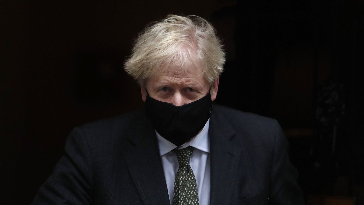 Prime Minister Boris Johnson leaves 10 Downing Street to attend the weekly Prime Ministers' Questions session in parliament in London, Wednesday, Dec. 9, 2020.