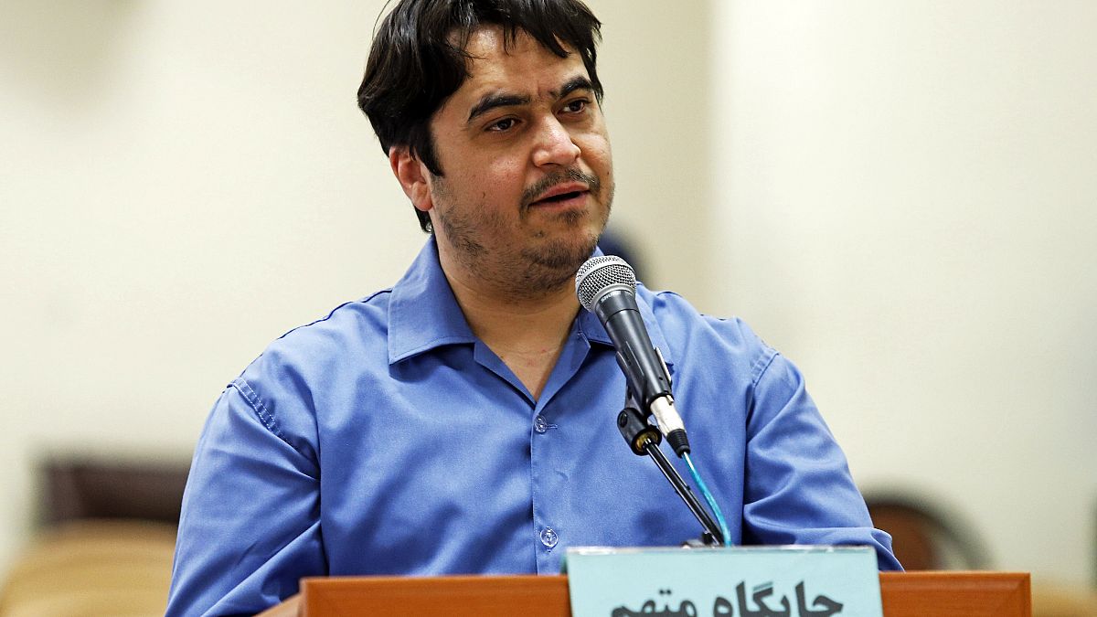 In this June 2, 2020 photo, journalist Ruhollah Zam speaks during his trial at the Revolutionary Court, in Tehran, Iran.