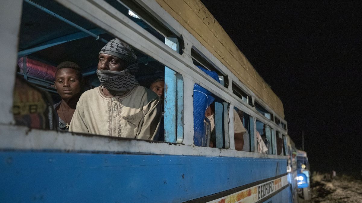 Tigrinyan refugees, who fled Ethiopia's conflict, arrive in convoys from Village 8 near the Lugdi border crossing, at Umm Rakouba refugee camp in Qadarif, eastern Sudan.