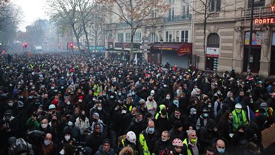 Protesters match against a protest against a proposed security bill in Paris