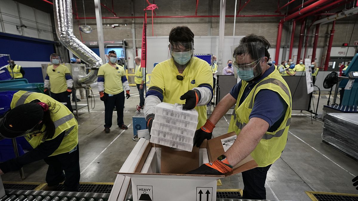 Boxes containing the Pfizer-BioNTech Covid-19 vaccine are prepared to be shipped at the Pfizer Global Supply Kalamazoo manufacturing plant.