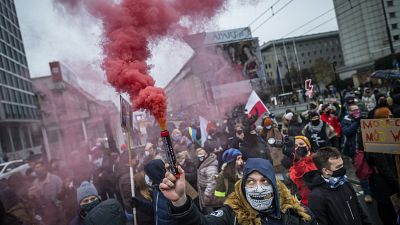 Protesters take part in demonstration of Women's Right movement to mark the anniversary of the introduction of martial law in communist Poland.