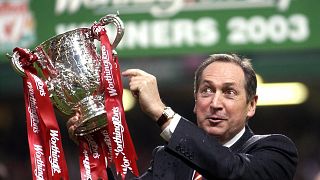 Gerard Houllier celebrates victory for Liverpool over Manchester United in the Worthington (League) Cup Final, March 2, 2003.