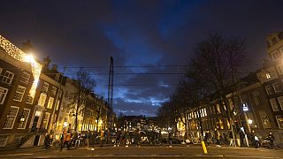 Long queues formed outside Amsterdam coffee shops and museums on Monday