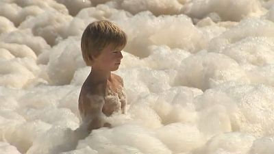 Australia's Gold Coast beaches swamped by foam caused by rough seas