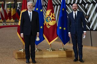 European Council President Charles Michel, right, and Montenegro Prime Minister Zdravko Krivokapic pose for photographers before their meeting at the European Council headquar