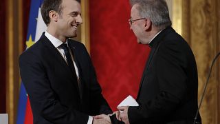 FILE: In this Jan.4, 2018 file photo, French President Emmanuel Macron greets Apostolic Nuncio to France Luigi Ventura during his New Year address to diplomats.