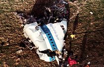 In this Dec. 22, 1988, file photo police and investigators look at what remains of the nose of Pan Am 103 in a field in Lockerbie, Scotland.