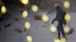 A snowstorm is hitting the US as it rolls out its coronavirus vaccine programme