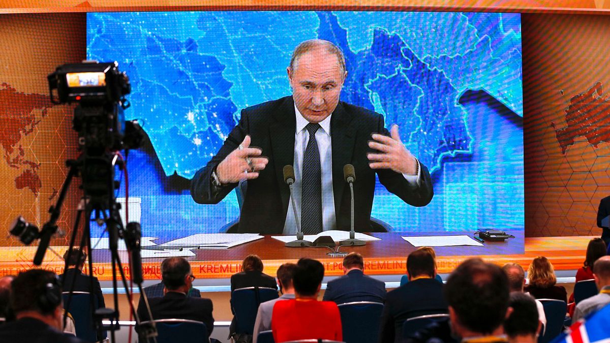 Russian President Vladimir Putin gestures as he speaks via video call during a news conference in Moscow, Russia, Thursday, Dec. 17, 2020. 