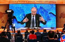 Russian President Vladimir Putin gestures as he speaks via video call during a news conference in Moscow, Russia, Thursday, Dec. 17, 2020.