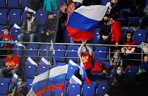 Russian spectators support their team during the Channel One Cup ice hockey match between Sweden and Russia in Moscow, Russia, Thursday, Dec. 17, 2020.