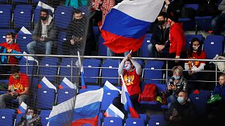 Russian spectators support their team during the Channel One Cup ice hockey match between Sweden and Russia in Moscow, Russia, Thursday, Dec. 17, 2020.